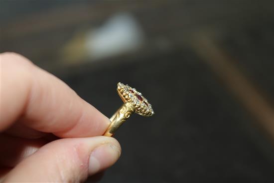 An early-mid 20th century 18ct gold, ruby and diamond marquise cluster ring, size M.